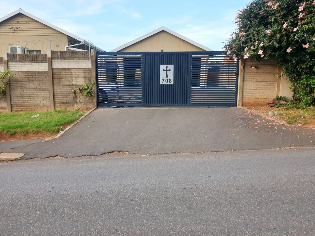 Driveway gate installed by Quality Design Doors