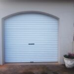 White Chromadek roll-up single garage door