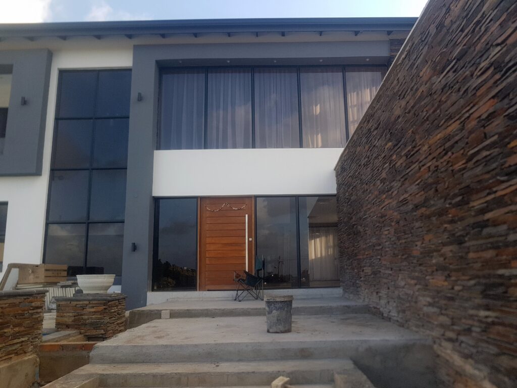 Modern home with full-height aluminium windows and doors